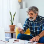 Tax forms and a calculator used to review the 2020 Recovery Rebate Credit